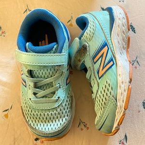 Toddler aqua New Balances size 7 with velcro strap.